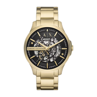 Goldene Armani Exchange Herrenuhr am Handgelenk, mit schwarzem Zifferblatt und skelettiertem Design